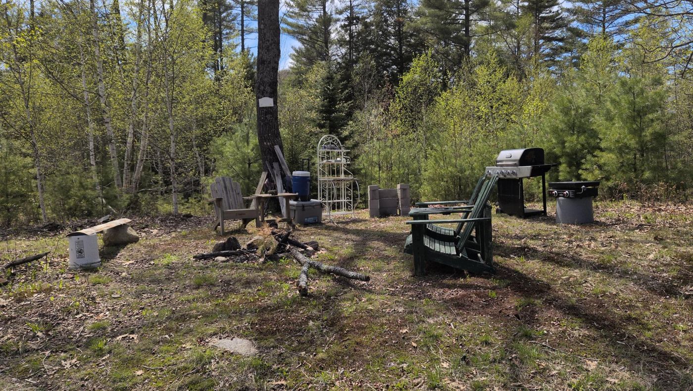 outdoor kitchen with fire circle at Bartertowne, Canaan New Hampshire