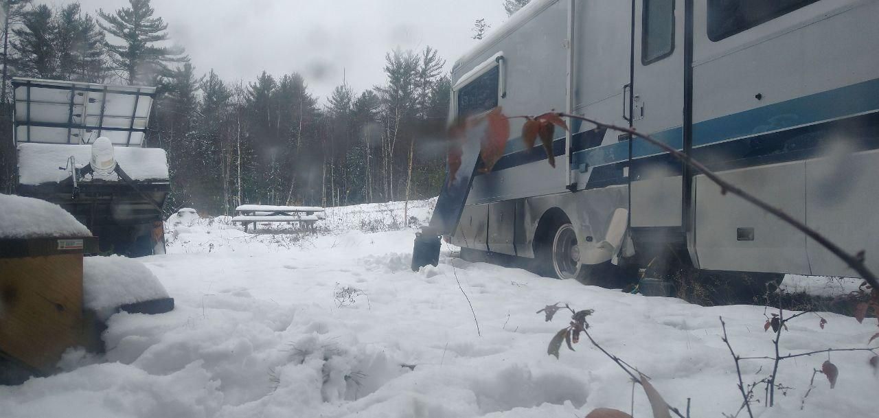 rv camper in deep winter snow at Bartertowne, Canaan New Hampshire