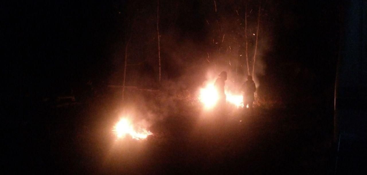 twin campfires glowing after dark at Bartertowne, Canaan New Hampshire